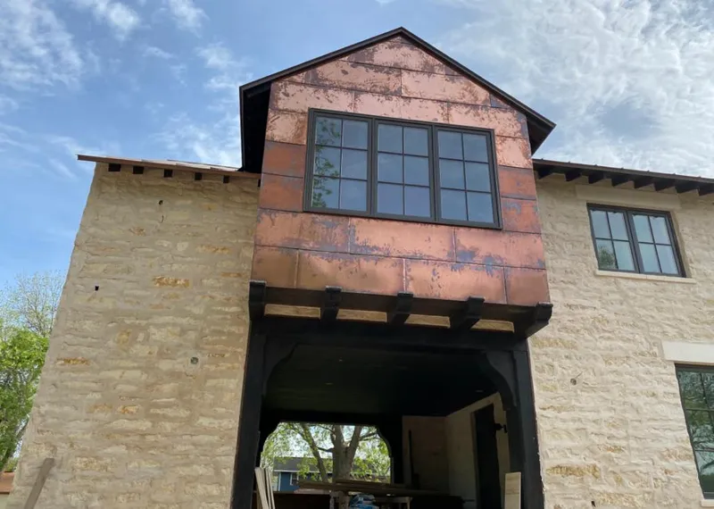 Copper metal panel facade on a stone building for Skylight Installation in Baton Rouge